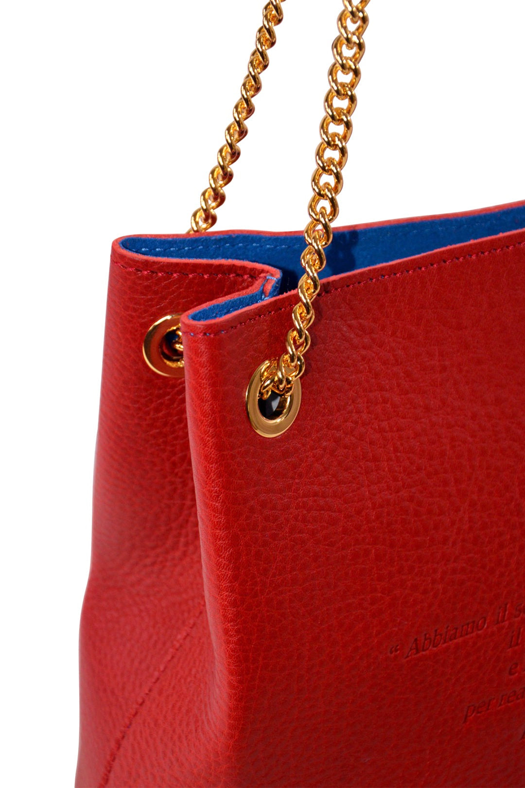 Red handbag with gold chain handle on a white background